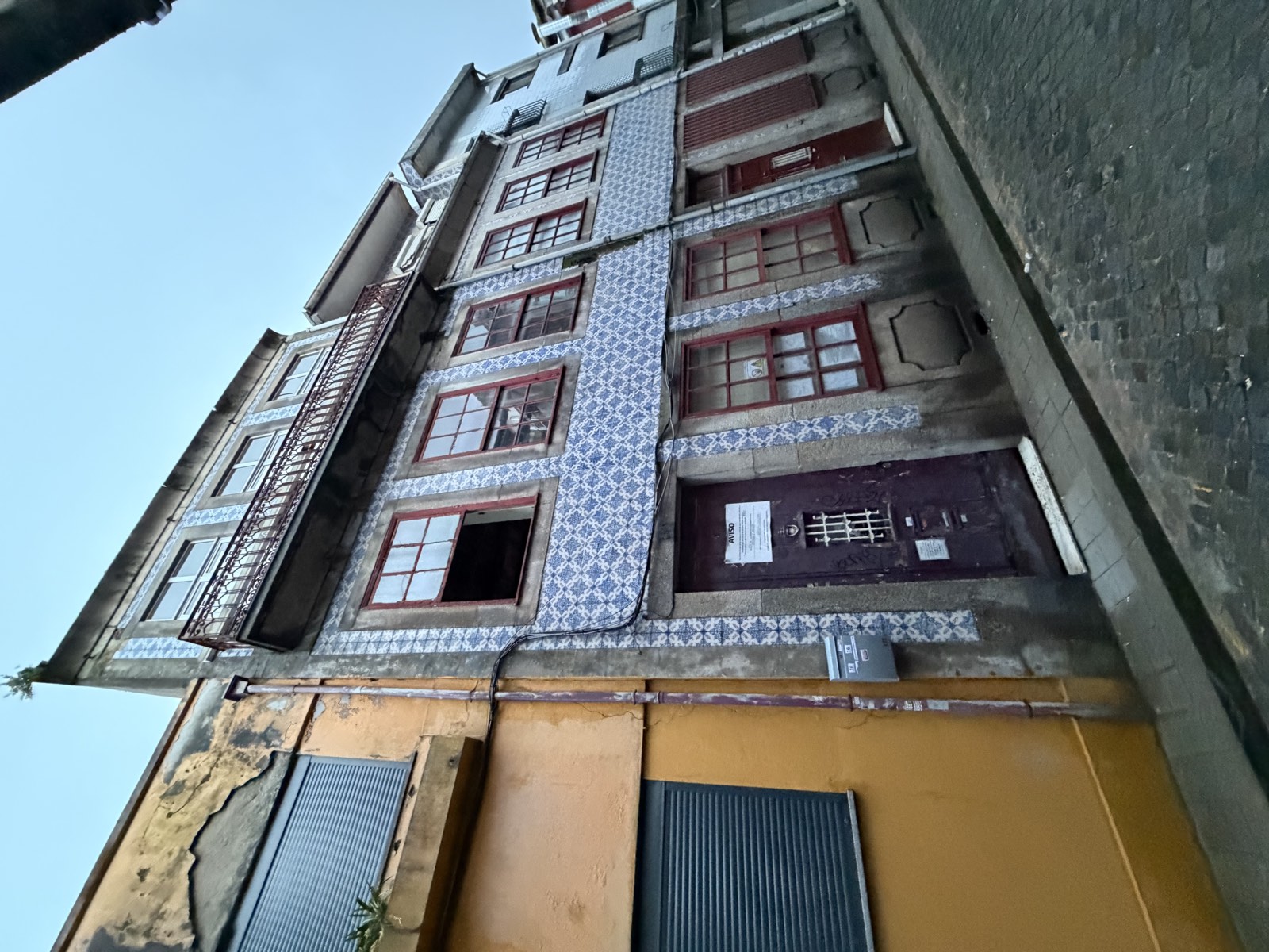 The tiled façade of the Poço das Patas building in Porto
